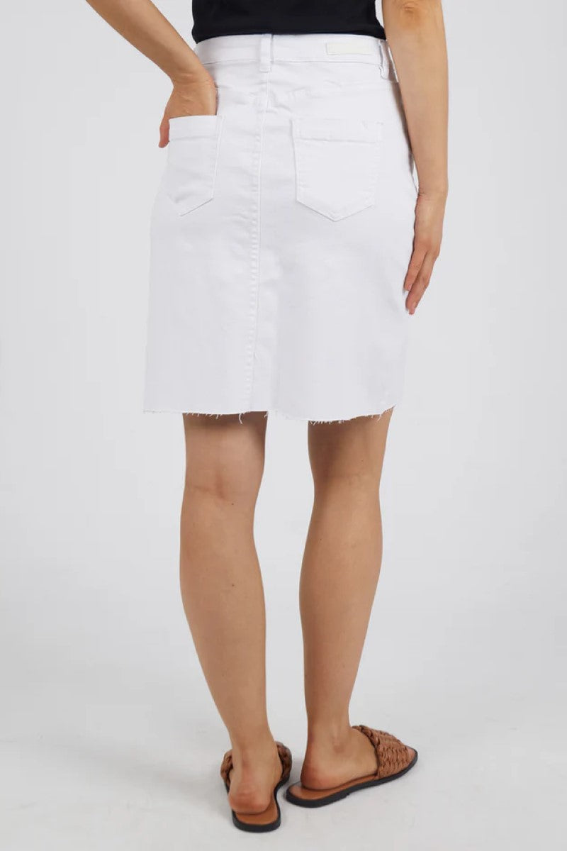 This close-up back view of the Belle Denim Skirt in Cloud Wash highlights the subtle back pockets, gentle fading, and classic seam detailing for a polished denim finish.