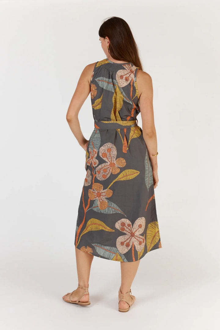 Woman wearing a floral dress on a white background