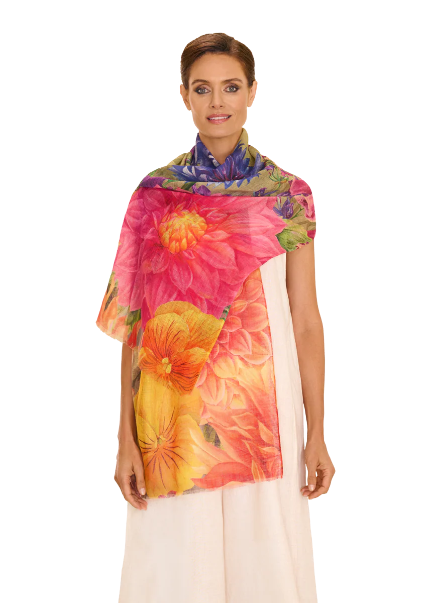 Woman wearing a colorful floral scarf on a white background