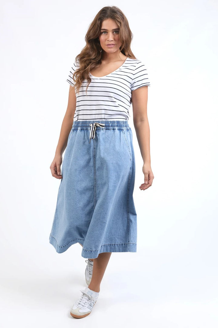 Front view of Greta Denim Skirt in light blue, featuring a classic high-waisted fit with front seam detailing, from Ivy Vibe Boutique.