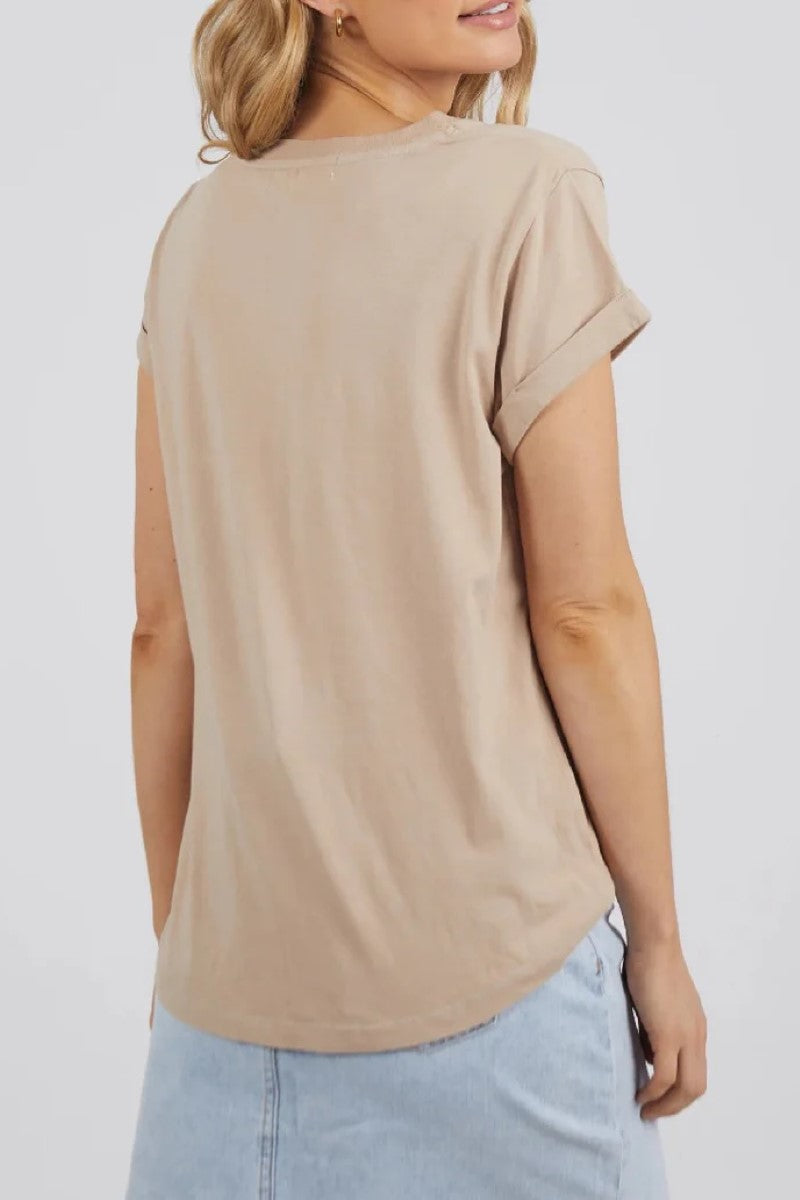 The Manly Vee Tee in Oatmeal is shown from the back, showcasing its clean, simple design and curved hem, crafted from ultra-soft 100% Pima Cotton — Ivy Vibe.
