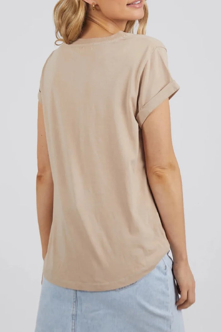 The Manly Vee Tee in Oatmeal is shown from the back, showcasing its clean, simple design and curved hem, crafted from ultra-soft 100% Pima Cotton — Ivy Vibe.
