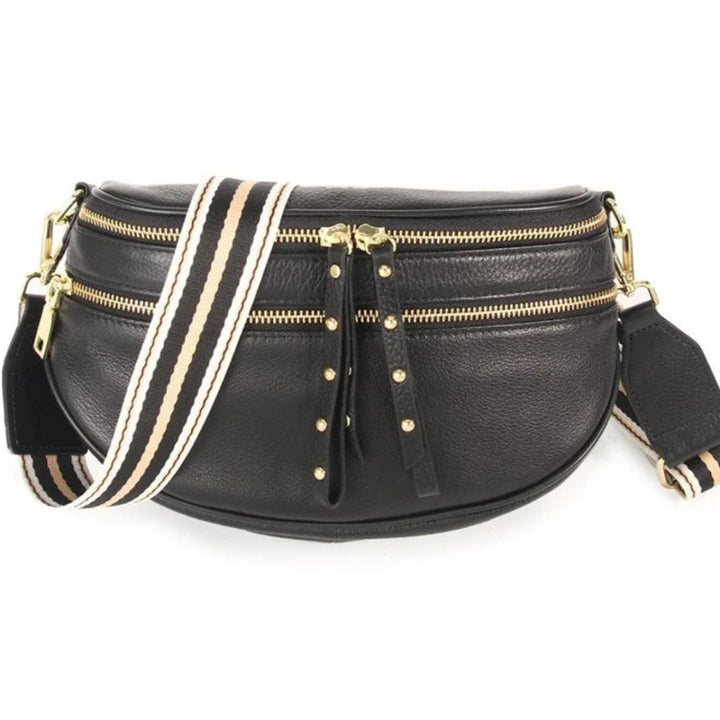 Voyager Bag in black with gold hardware from Ivy Vibe, featuring a sleek structured design, top handles, and an adjustable shoulder strap.