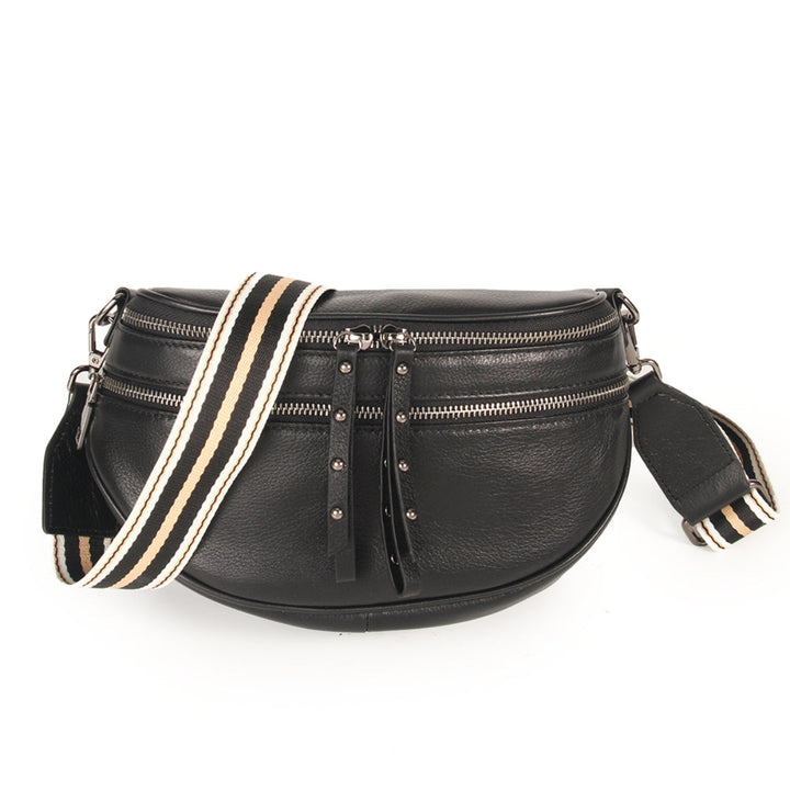 Voyager Bag in black with gunmetal hardware from Ivy Vibe, designed with a structured silhouette, top handles, and an adjustable shoulder strap.