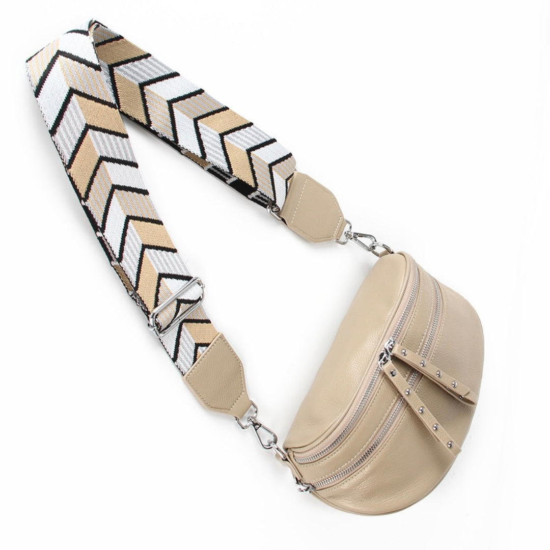 Voyager Bag in taupe with silver hardware from Ivy Vibe, featuring a structured shape, top handles, and adjustable shoulder strap.