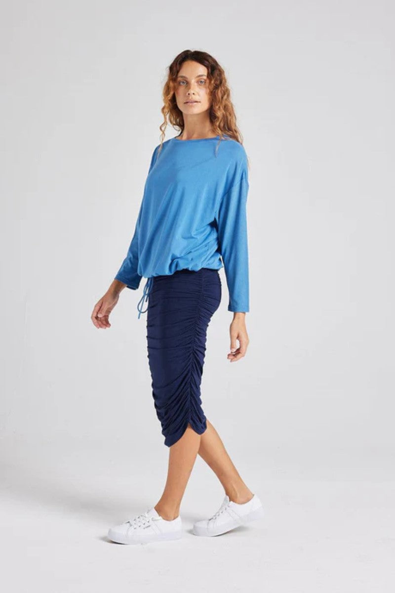 Side view of the Lady Drawstring Sweater in ocean blue, displayed at Ivy Vibe, highlighting its relaxed fit and adjustable drawstring hem for a casual, comfortable look.