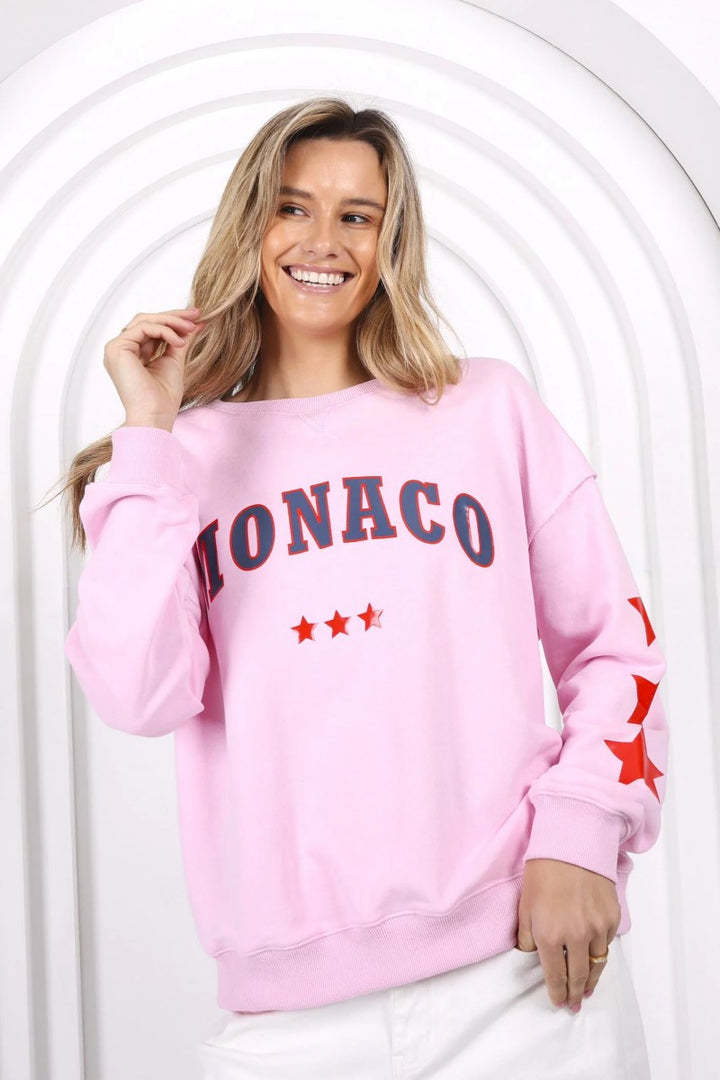 Close-up of the MJ Sweat in Pink from Ivy Vibe, highlighting the soft textured fabric and subtle Monaco print detail for a cozy, stylish finish.