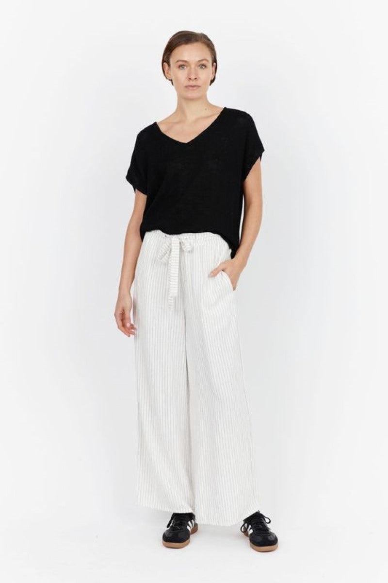 Front view of model wearing Carbon Nero Linen Pant at Ivy Vibe, featuring bold vertical stripes, full-length cut, and a relaxed, tailored fit.