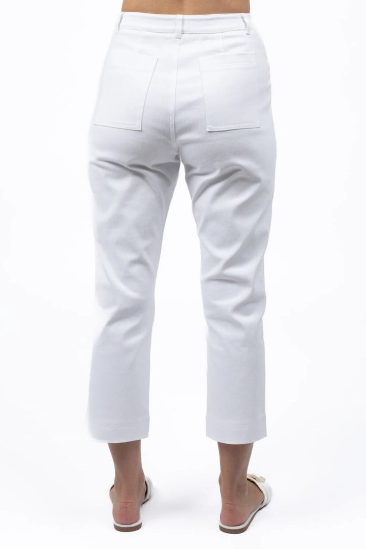 White pants worn by a person on a white background