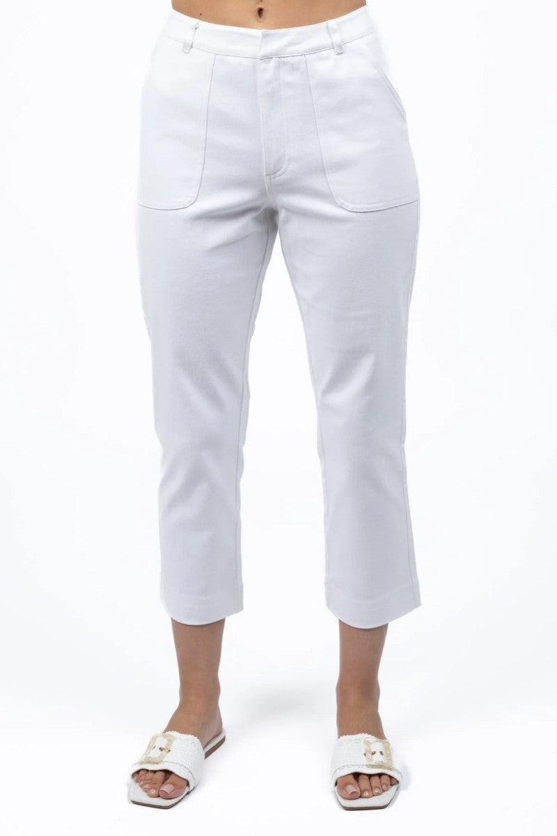 White pants worn by a person on a white background