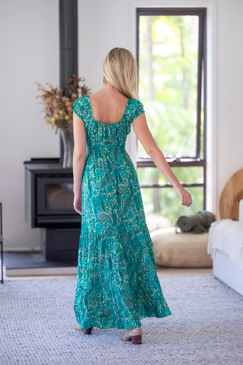 Back view of the Rosa Dress in Beatrix print, highlighting its graceful fit and elegant flow.