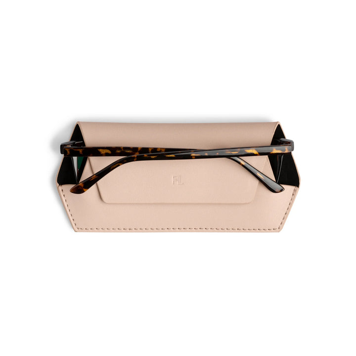 Beige clutch with tortoiseshell handle on a white background