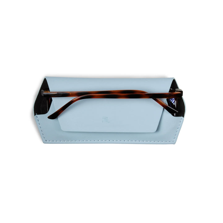 Eyeglass case with tortoiseshell arms on a white background