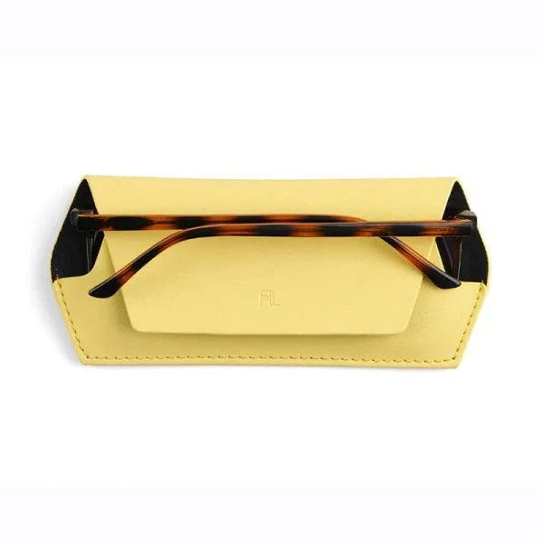 Gold sunglasses case with tortoiseshell arms on a white background