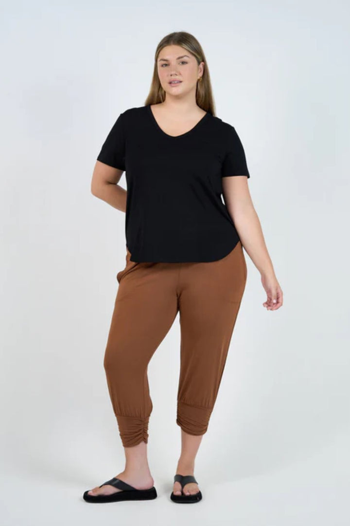 Front view of the Veronica Tee in black, displayed at Ivy Vibe, featuring a subtle V-neckline, short sleeves, and a relaxed, flattering fit.