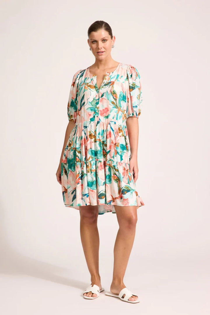 Woman wearing a floral dress on a white background