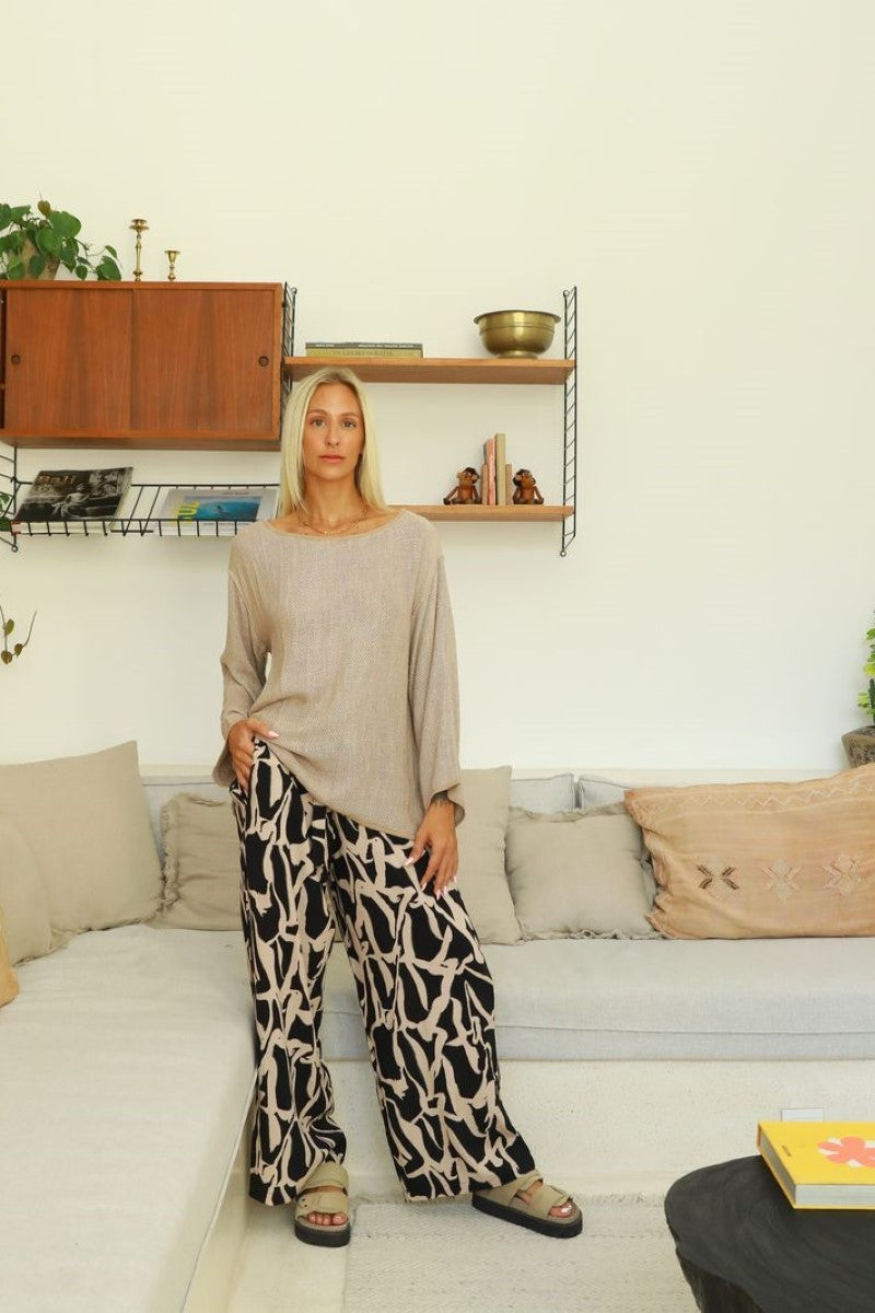 Lifestyle image of the Alex Pant in Black Cinnamon from Ivy Vibe, styled with a relaxed fit and wide-leg cut, showcasing effortless movement and everyday elegance.