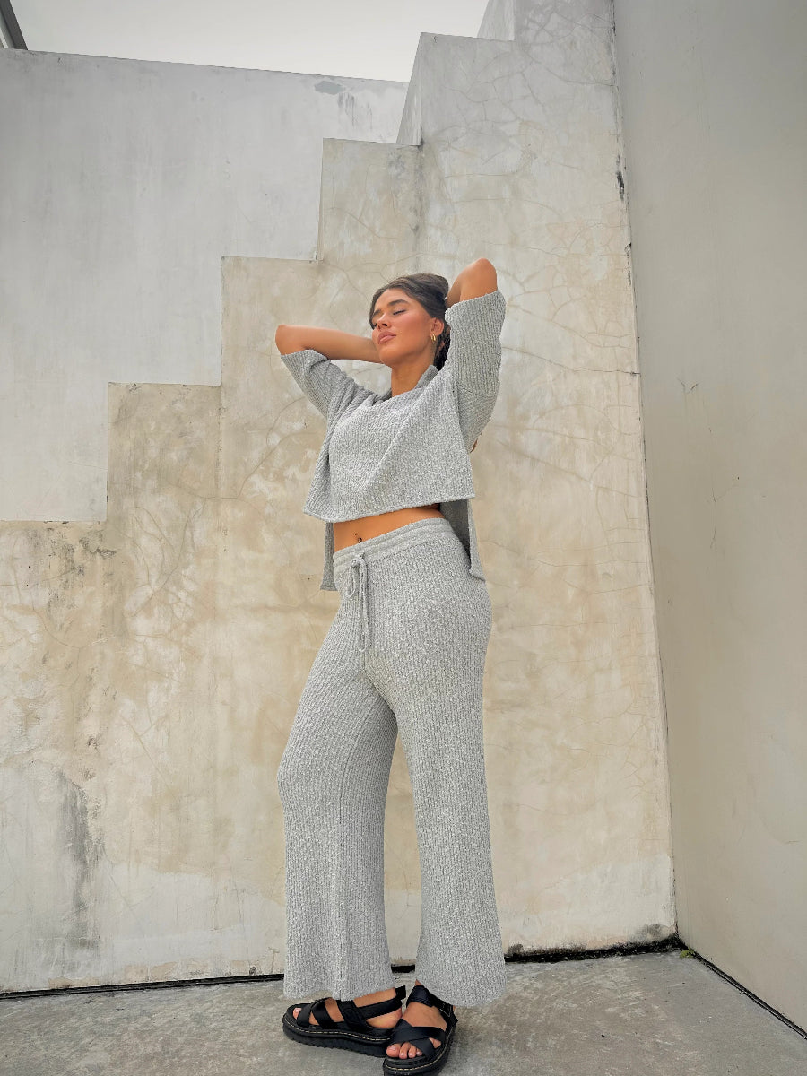 Full-length view of gray knit cropped top and wide-leg pants.