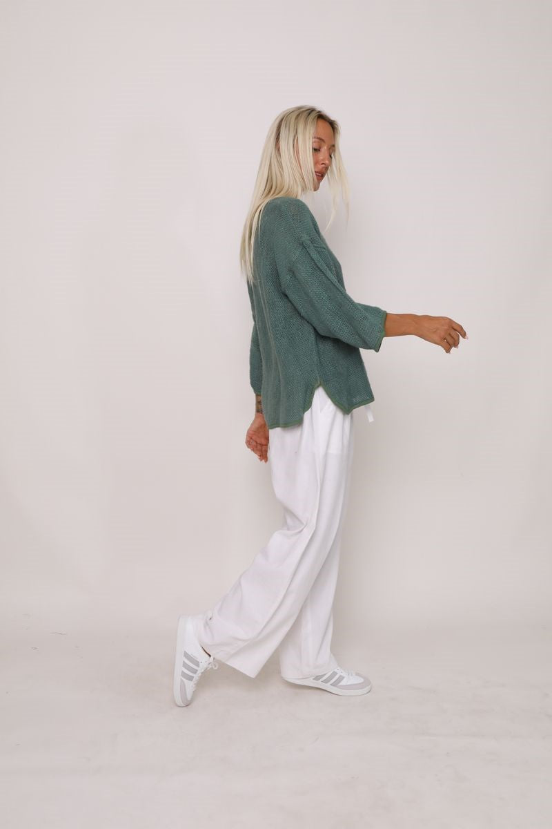 Side view of the Aroma Top in Kashmir Green, displayed at Ivy Vibe, highlighting its relaxed fit and soft, flowing fabric.