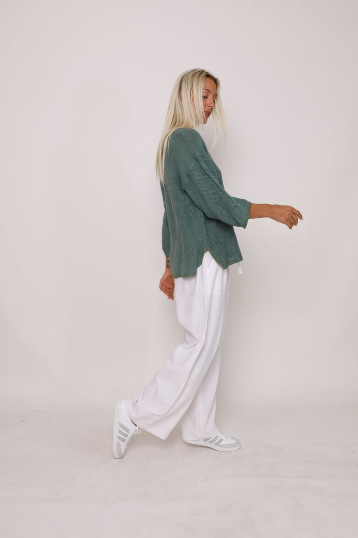 Side view of the Aroma Top in Kashmir Green, displayed at Ivy Vibe, highlighting its relaxed fit and soft, flowing fabric.