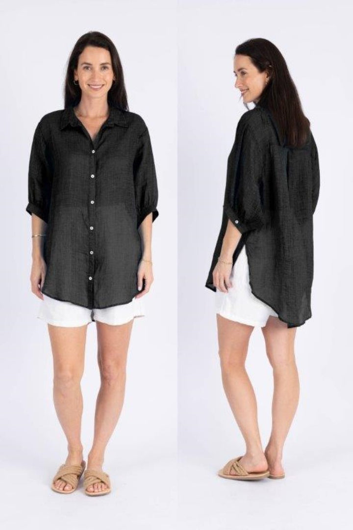 Front view of Ivy Vibe Athena Top in black – soft, lightweight blouse featuring a V-neckline, flutter sleeves, and relaxed fit