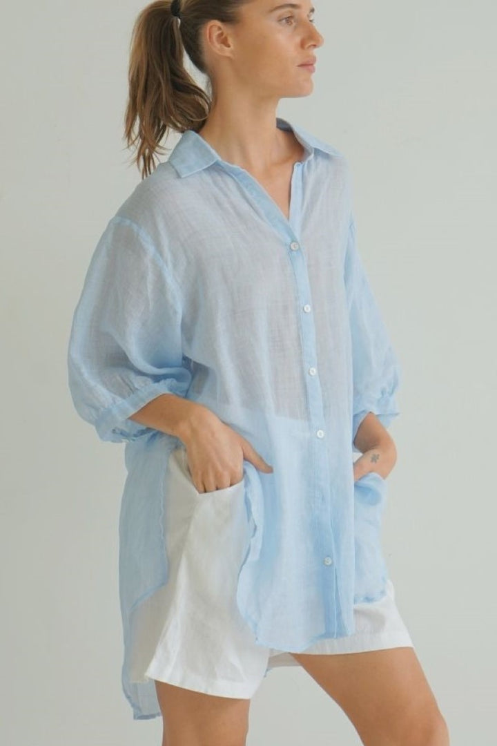Front view of Ivy Vibe Athena Top in ice blue – airy, lightweight blouse with V-neckline, flutter sleeves, and relaxed silhouette