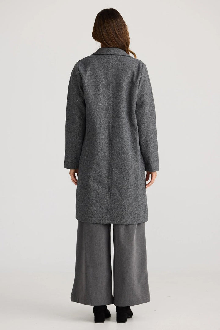 Back view of the Bella Coat in Charcoal Marble, showcasing its knee-length cut and smooth, streamlined silhouette