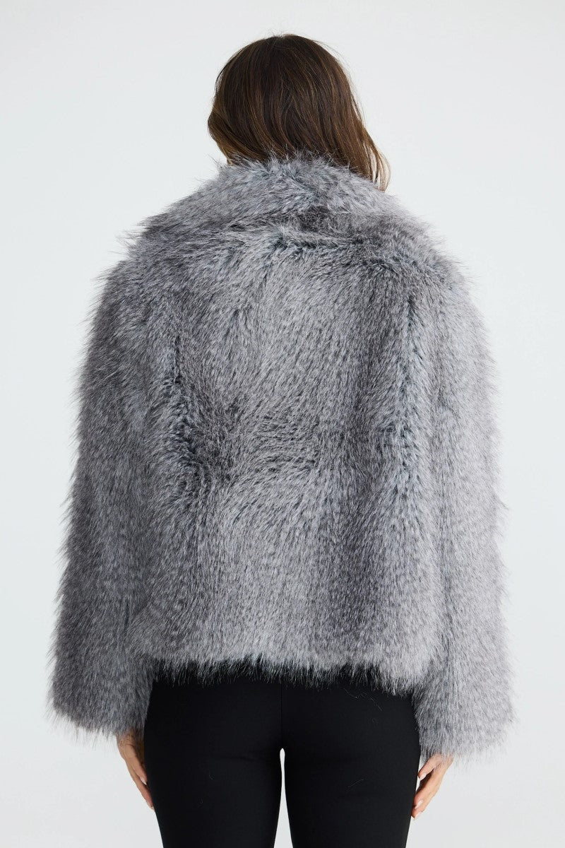 Back view of the Bertoli Jacket in Grey Speckle, highlighting its long sleeves, high neck, and lightweight quilted design.
