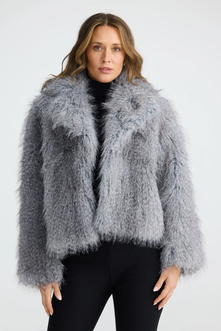Front view of the Bertoli Jacket in Grey Speckle, featuring a high neck, long sleeves, and zip-front closure with welt and patch pockets.