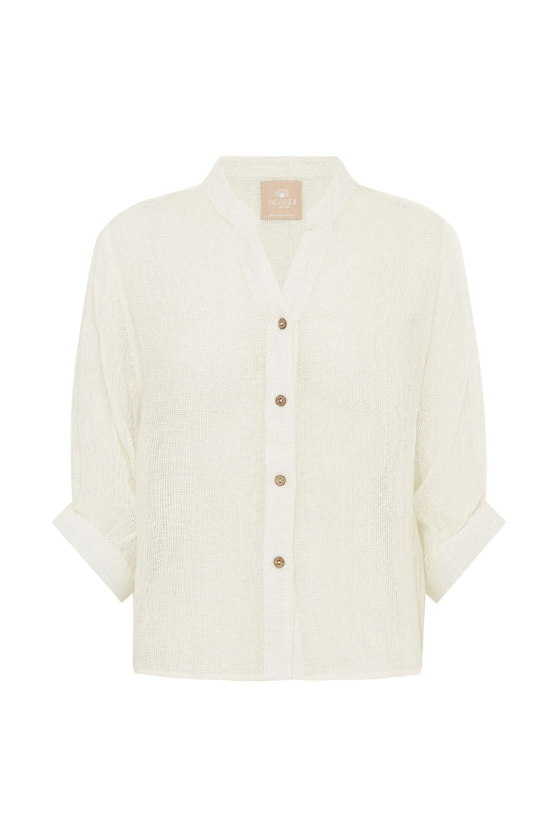 White blouse with buttons and rolled sleeves on a white background