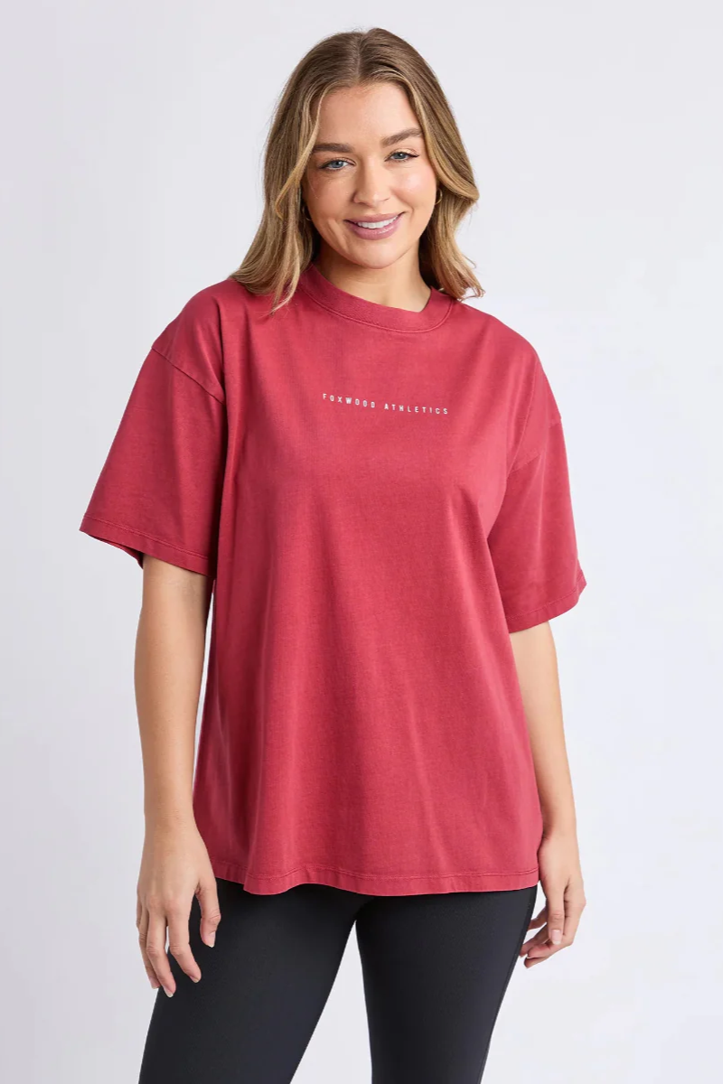 Woman wearing a red t-shirt with text on a white background
