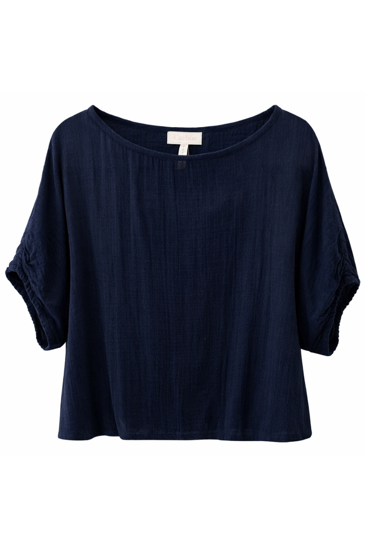 Navy blue shirt with a visible brand label on a white background
