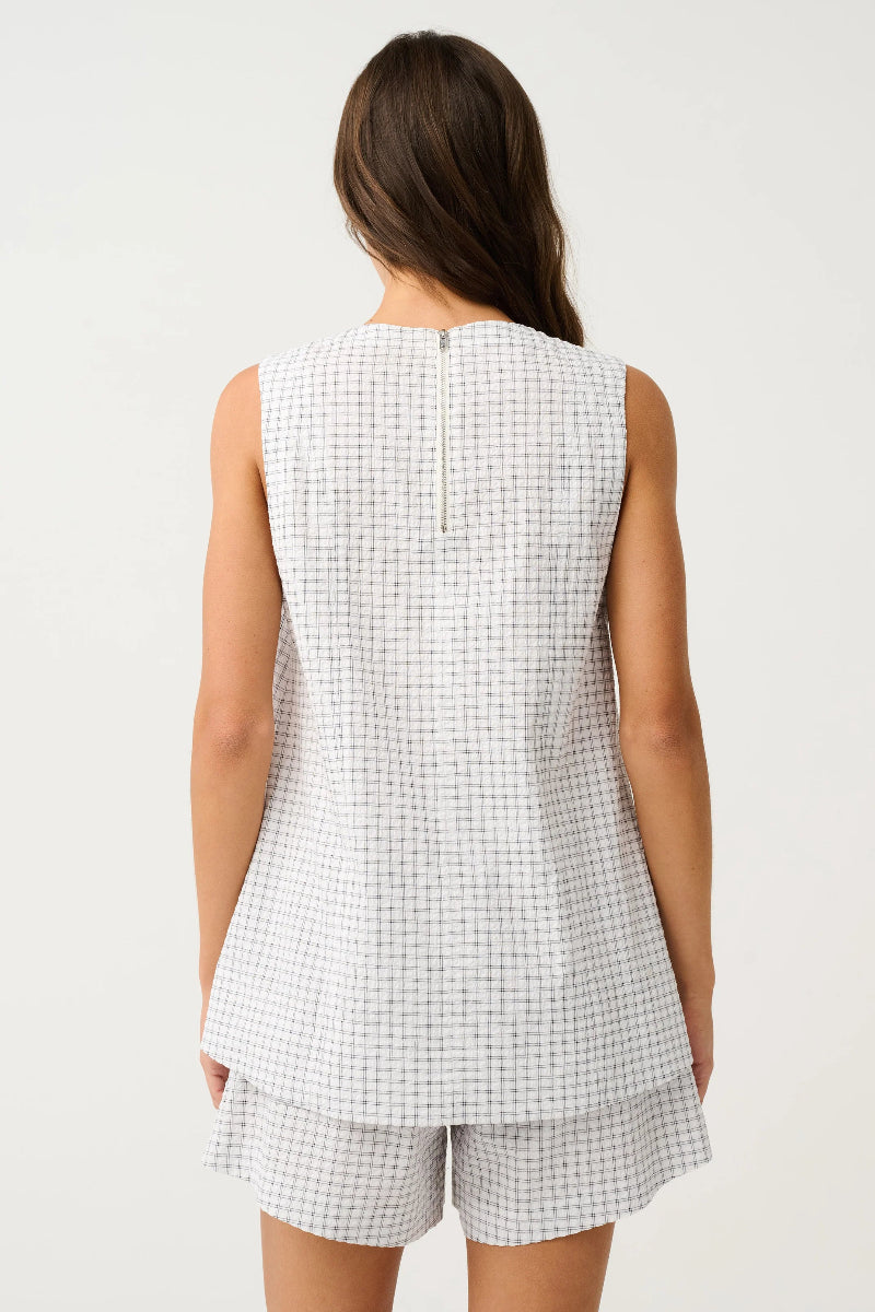 Back view of sleeveless check top and matching shorts.