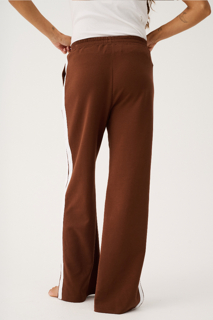 Brown wide-leg pants worn by a person on a white background