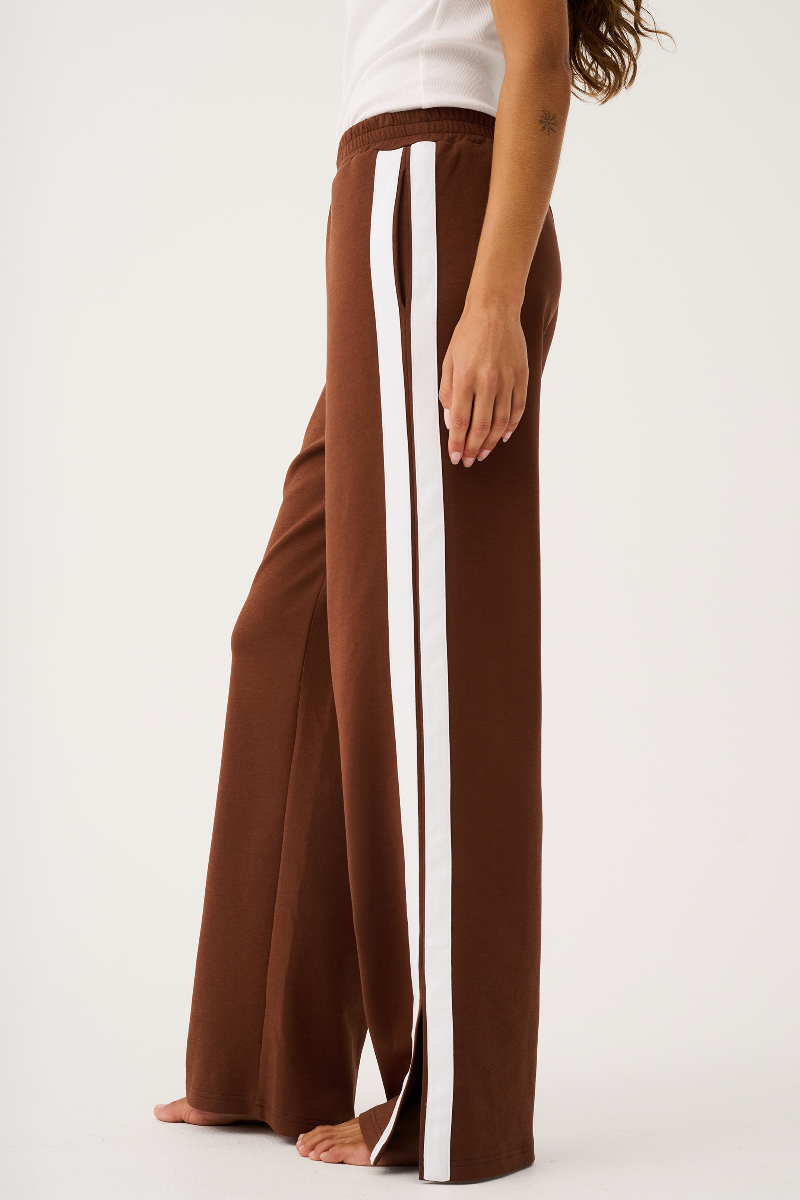 Brown wide-leg pants with a white stripe on a white background