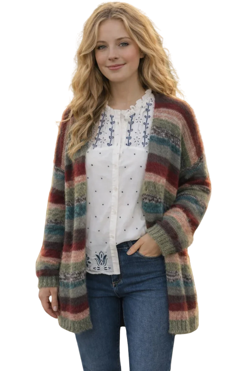 Woman wearing a colorful striped cardigan over a white blouse with blue patterns.