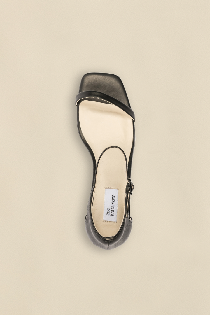 Top view of the Delight Wedge in Black, showcasing its rounded toe and smooth, polished finish