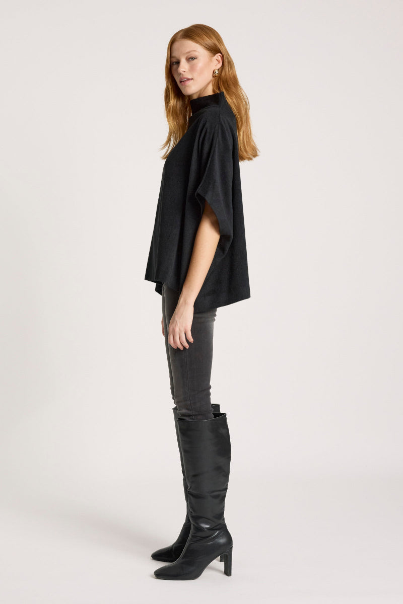 Woman wearing Azul Poncho in Black