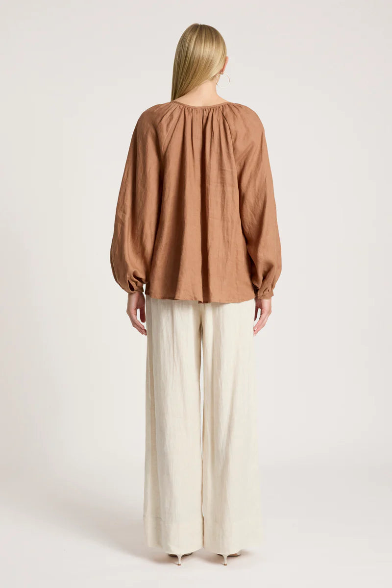 woman wearing Bajau Blouse in Clay