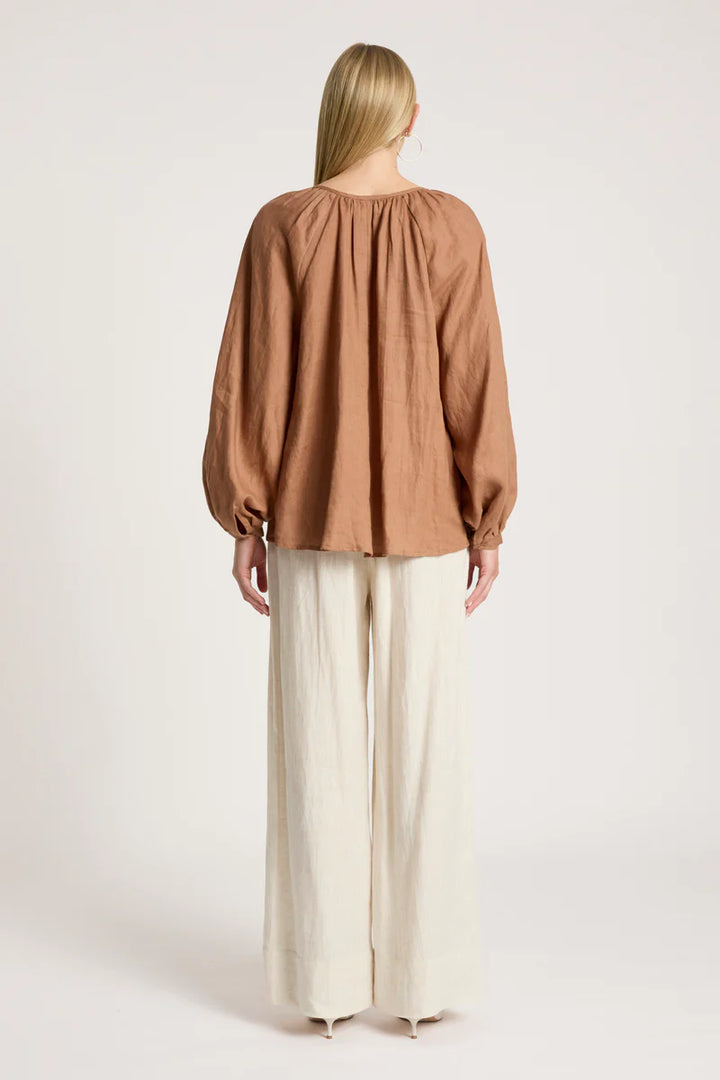 woman wearing Bajau Blouse in Clay