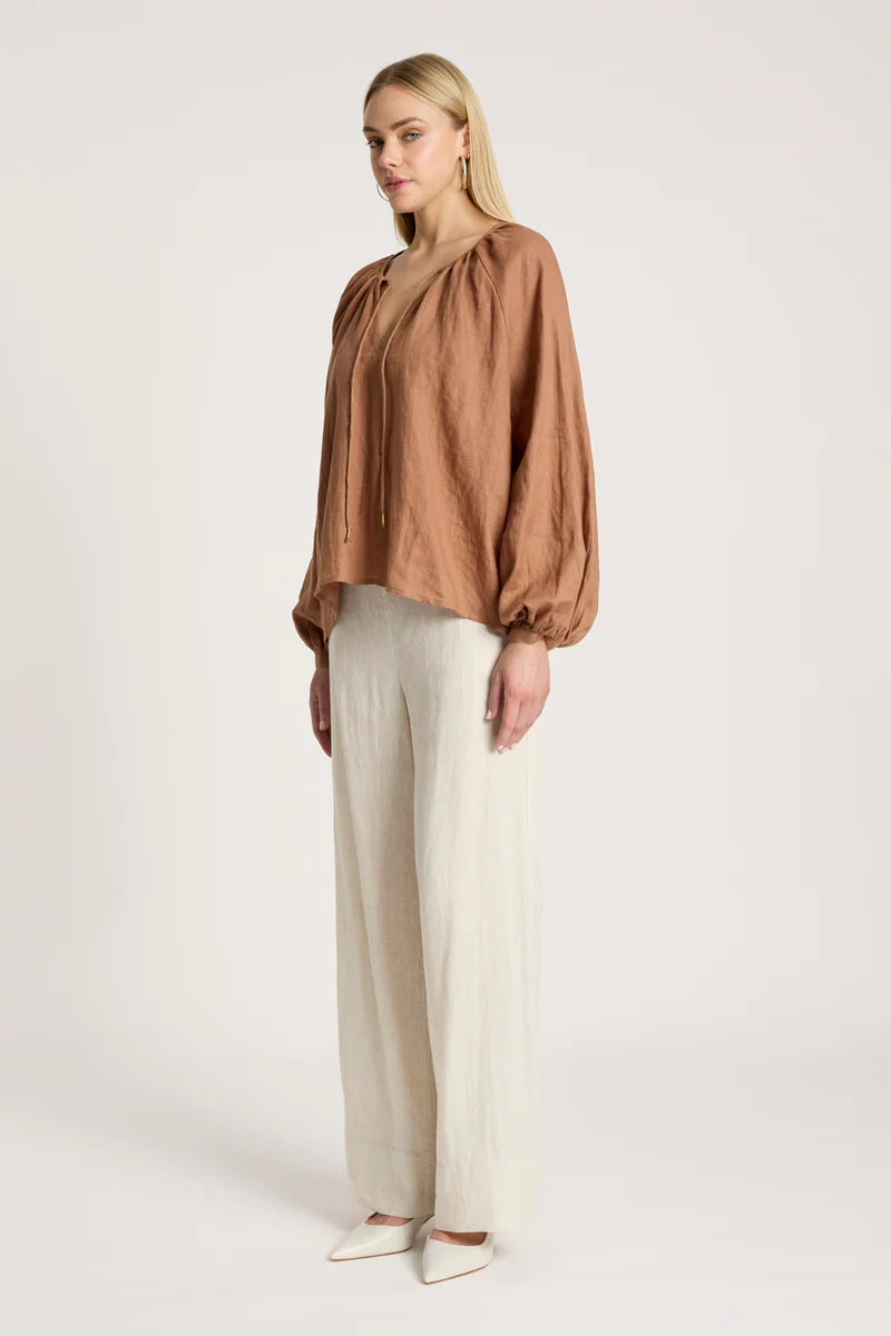 woman wearing Bajau Blouse in Clay