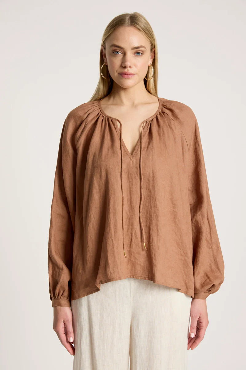 woman wearing Bajau Blouse in Clay