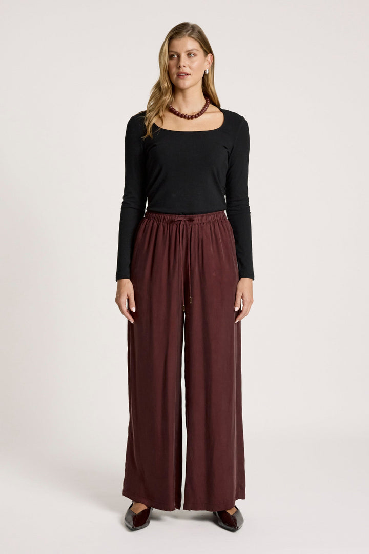 woman wearing Calista Pant in Mahogany