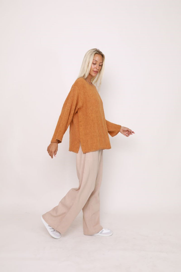 Side view of the Elena Top in Bran, showcased at Ivy Vibe, highlighting its relaxed oversized fit and textured handwoven cotton hessian fabric.
