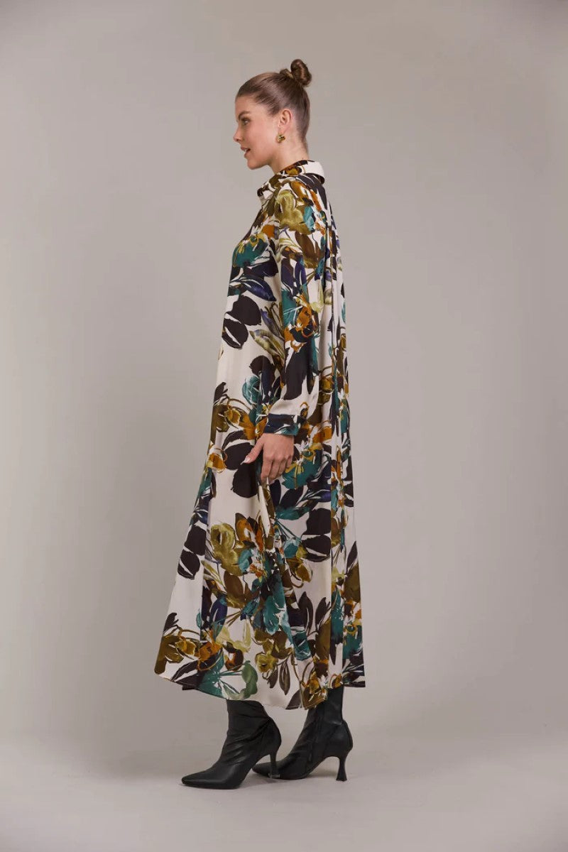 Side view of Elsie Shirt Dress in botanical tusk print, showcasing the relaxed fit and button-down design, from Ivy Vibe Boutique.