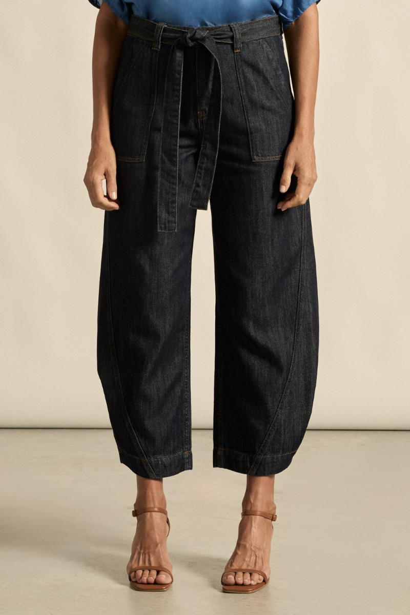 This is a close-up image of the Embark Jean in dark denim, highlighting the rich indigo wash, detailed stitching, and premium denim texture, available at Ivy Vibe.
