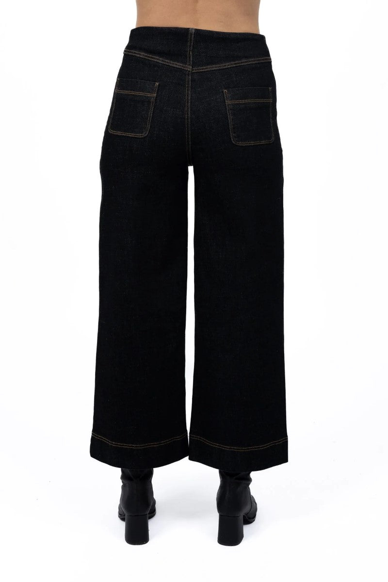 Back view of Fleetwood Jean in black, showcased at Ivy Vibe Boutique, highlighting classic back pockets and a sleek high-waisted, straight-leg design.