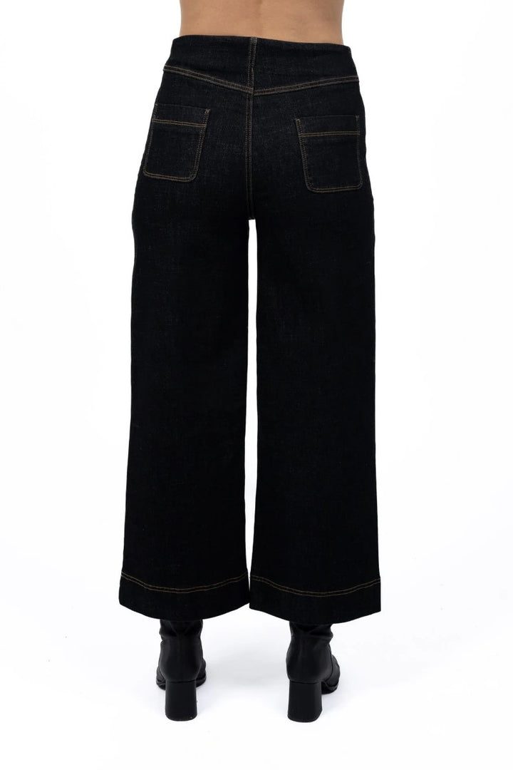 Back view of Fleetwood Jean in black, showcased at Ivy Vibe Boutique, highlighting classic back pockets and a sleek high-waisted, straight-leg design.