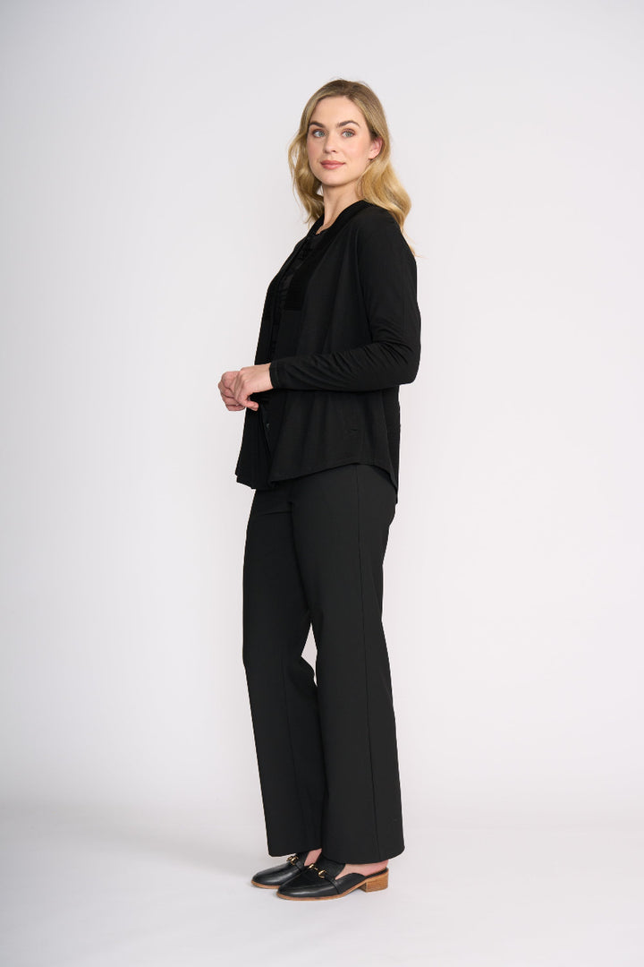 Woman wearing a black outfit on a white background
