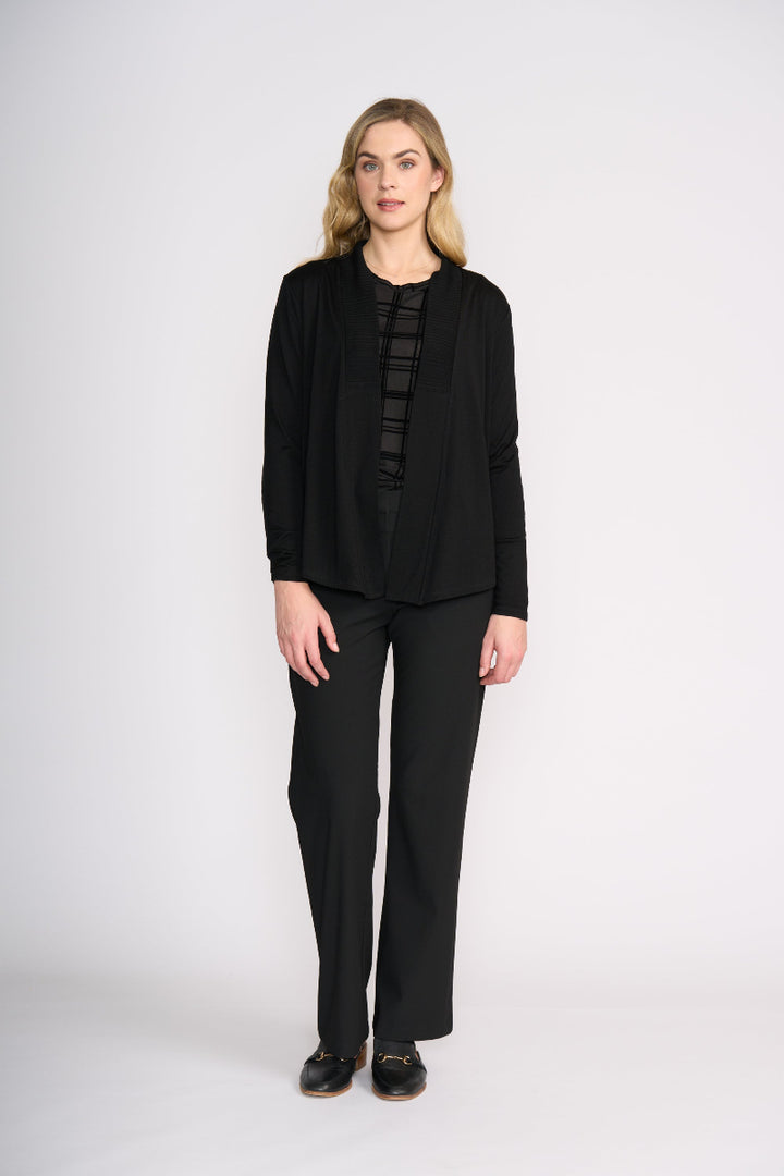 Woman wearing a black outfit on a white background
